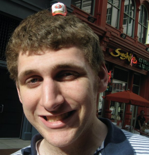 JORDAN CARR WEARS A TINY TINY HAT FOR YOUR AMUSEMENT